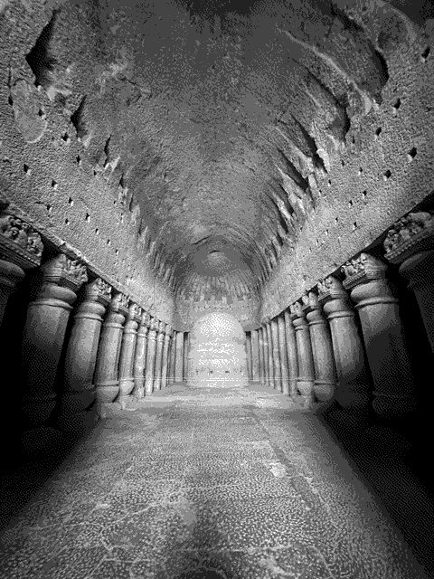 The interior of a Buddhist temple carved into the hills.