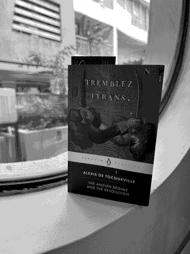 a picture of 'The Ancien Régime and the French Revolution' by Alexis de Tocqueville in situ.